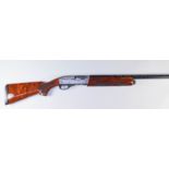 A Semi Automatic 12 Bore Shotgun, by Remington, Model 1100 Super Deluxe, Serial No. R294914B, the