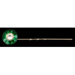 A Diamond and Emerald Stick Pin, in gold coloured metal mount, the circular terminal set with a