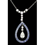 A Diamond and Aquamarine Pendant, Modern, in 18ct white gold mount, the tear drop shaped open loop