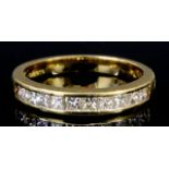 A Diamond Half Hoop Eternity Ring, Modern, in 18ct gold mount, set with ten princess cut diamonds,