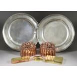 Two Victorian Embossed Copper Oval Jelly Moulds, with reeded sides and patterned tops, 6.25ins x 3.
