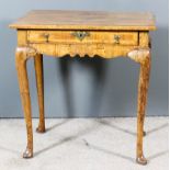 An 18th Century Walnut Lowboy, the quarter veneered top later inlaid with lozenge shaped centre