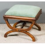 A 19th Century Mahogany Square Stool, upholstered in green dralon, on X-pattern end supports and