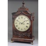 A Late George III Mahogany Mantel Clock, the 8ins diameter painted domed metal dial with Roman