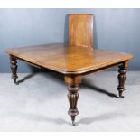 A Victorian Mahogany Rectangular Extending Dining Table, with three extra leaves, with moulded
