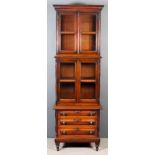 A Victorian Panelled Mahogany Three-Tier Waterfall Bookcase, the upper part with moulded cornice,