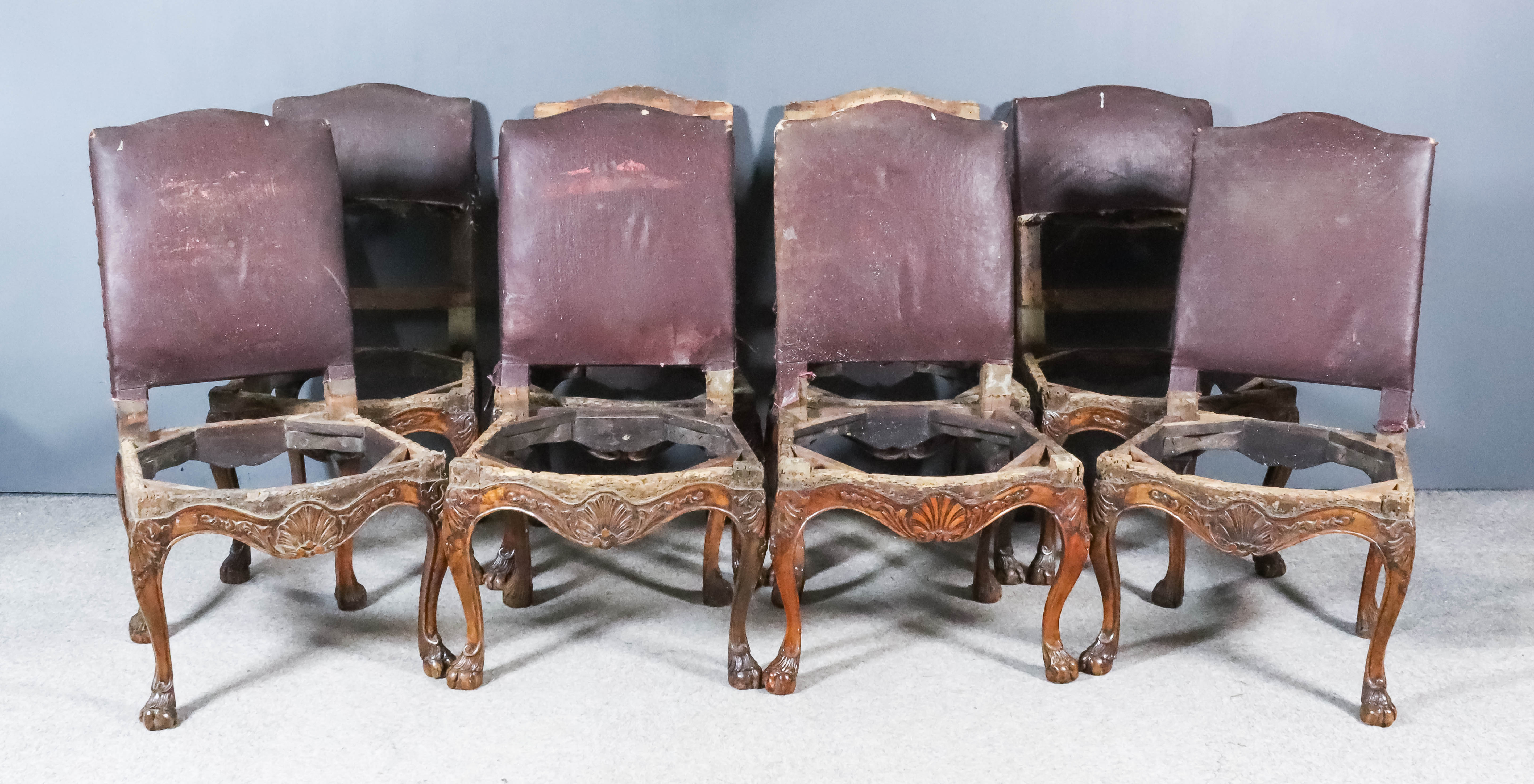 A Set of Eight 19th Century French Highback Dining Chairs of "Regence" Design, with arched crest