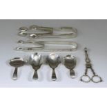 Two George III Silver Caddy Spoons, Two Other Silver Caddy Spoons, a Pair of Sugar Nips, and