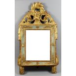 A Continental Painted and Gilt Wall Mirror, 18th Century, the shaped and pierced cresting carved
