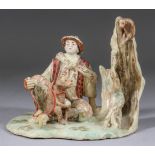 A Kayo Satsuma Model of a Seated Figure with Two Monkeys, 19th Century, the seated male figure