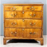 An 18th Century Provincial Walnut and Grained Wood Sided Chest, with three-plank top and moulded