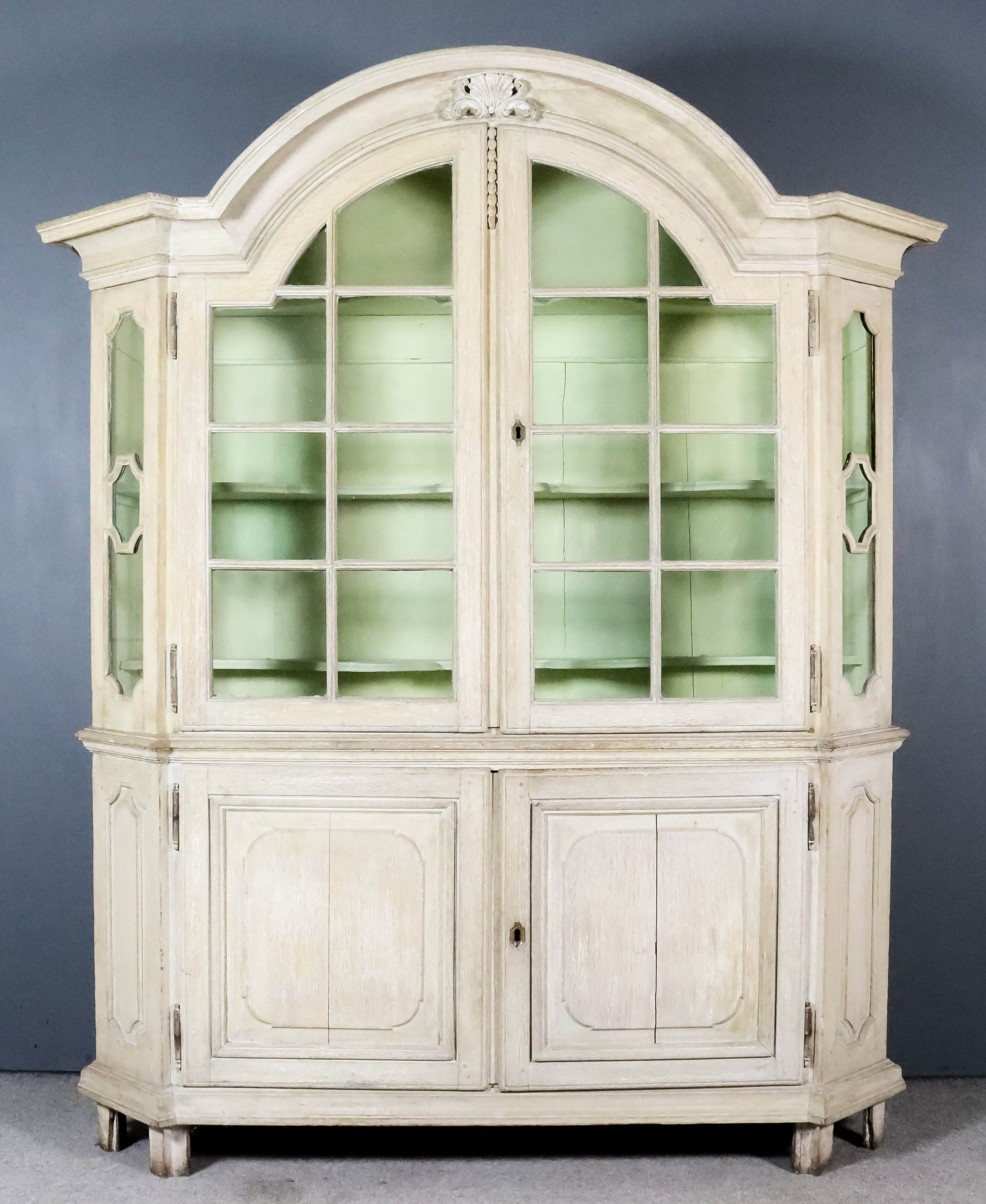 A 19th Century Dutch Panelled Limed Oak Display Armoire of "17th/18th Century" Design, the upper
