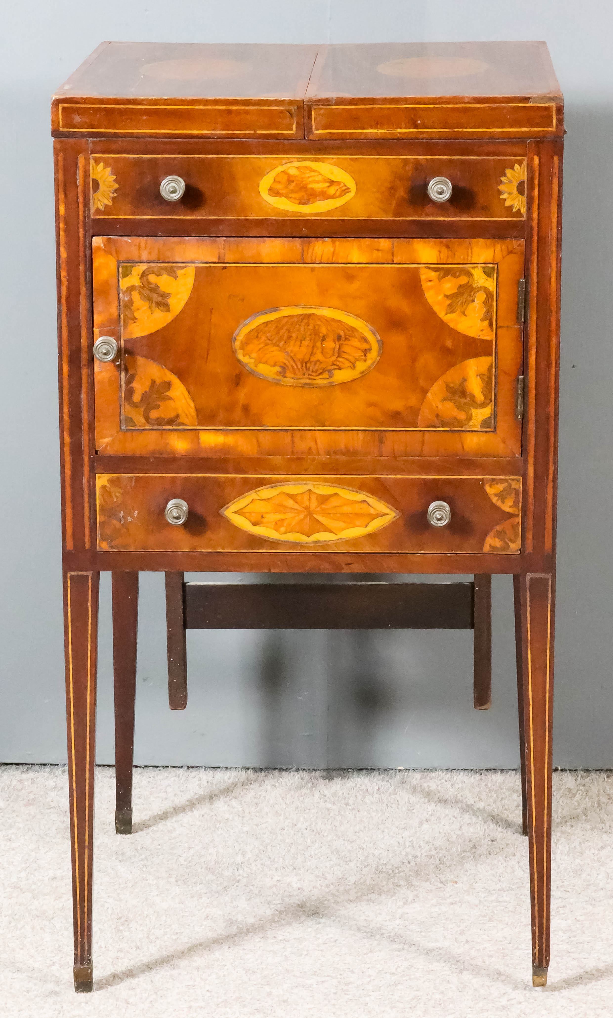 A George III Gentleman's Mahogany Enclosed Wash Stand, the top and front inlaid with oval shell