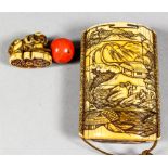 I* A Japanese Ivory Four-Case Inro with gilt lacquer interior, the exterior carved with a lake scene