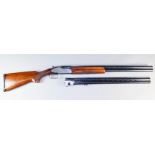 A 12 Bore Side by Side Over and Under Shotgun, by Rizzini, with two sets of barrels, both Serial No.