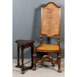 A 19th Century Oak Highback Hall Chair and a Small Oak Occasional Table, the hall chair of "17th