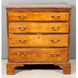 A George III Mahogany Chest, with moulded edge to top, fitted with a brushing slide and four long