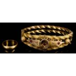 A Gold Coloured Metal Twin Rope Pattern Stiff Bangle, the face with oval and shaped panels gypsy set