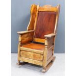 A 19th Century Panelled Mahogany Wingback Rocking Chair, with shaped wings, flat shaped arms and box