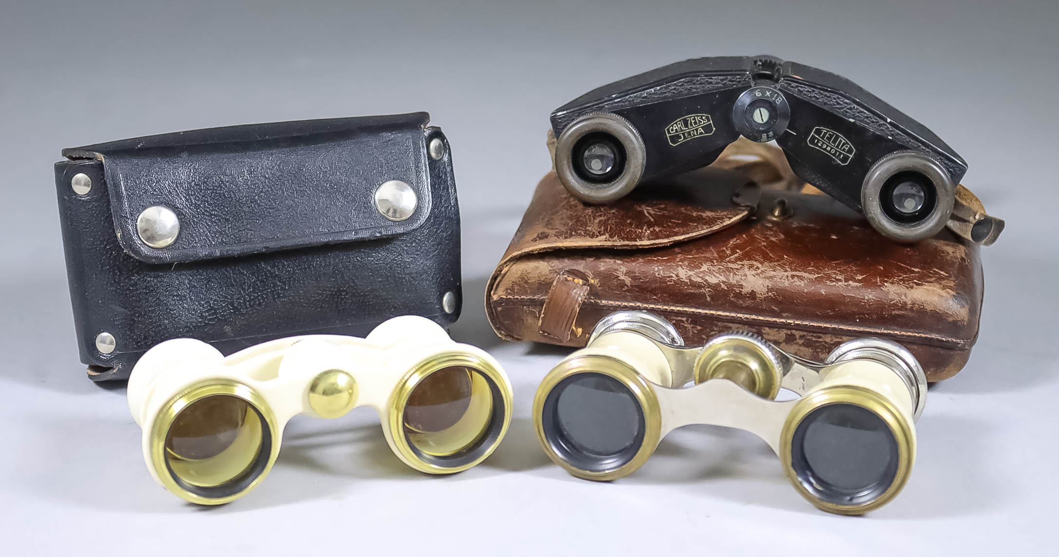 A Pair of Carl Zeiss "Telita" 6x18 Miniature Prismatic Binoculars, Serial No. 1298011, and brown