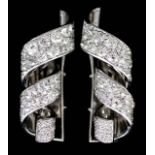 A Pair of Continental Diamond Clips, in 18ct white gold mount, of ribbon pattern, set with brilliant