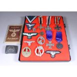 A Second World War German Iron Cross Medal, a collection of other Second World War German badges and