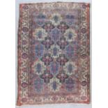 Two Anatolian Rugs, one woven in bold colours with three rows each of five of guls filled with a