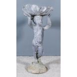 A Cast Lead Putti and Shell Pattern Bird Bath, on circular base, 15ins x 12ins x 28ins high