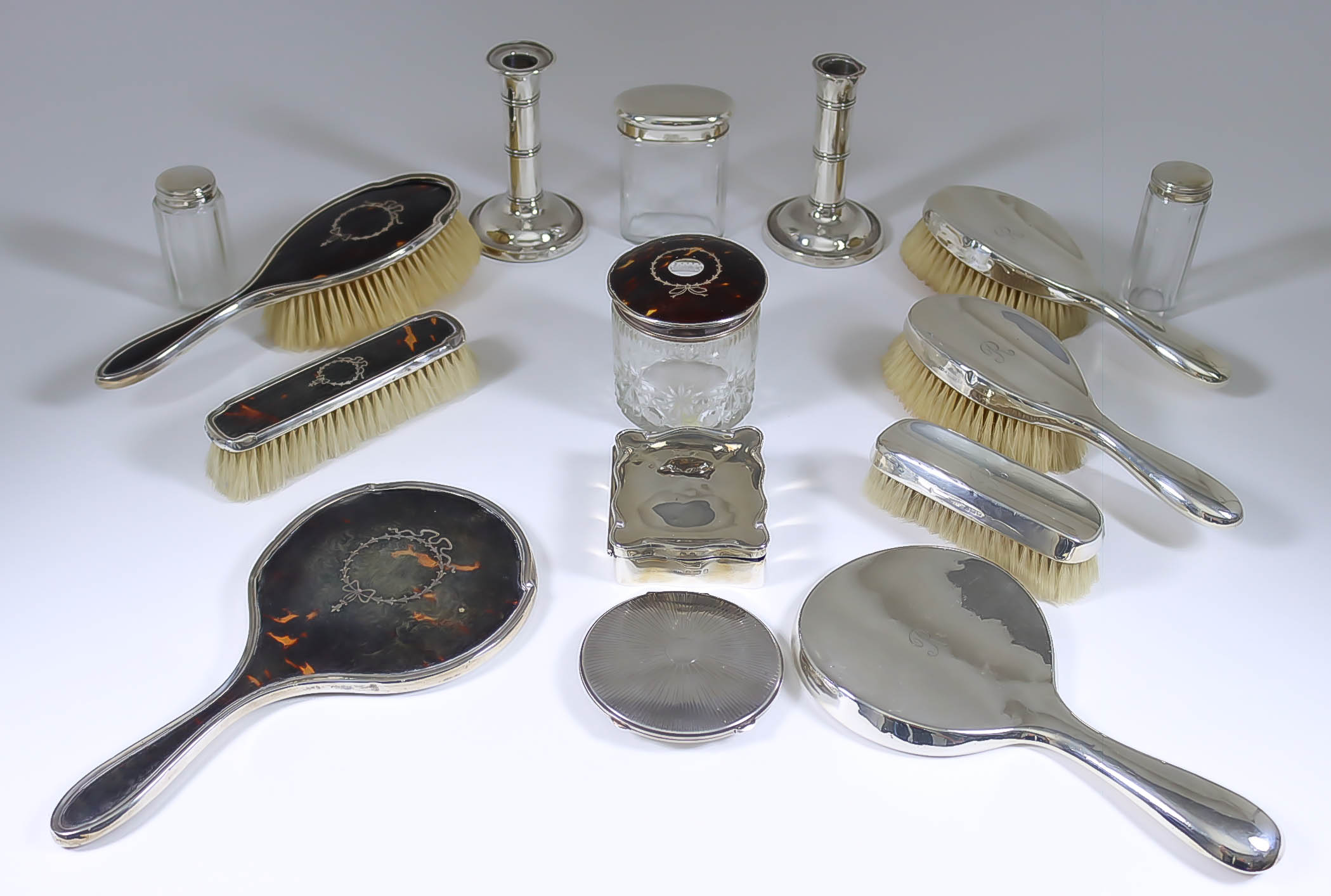 A George VI Silver Circular Compact, and mixed silver topped and silver backed dressing table items,