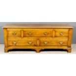 A Modern Panelled Oak Low Chest, with moulded edge to top, fitted five drawers with bevelled edges