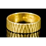 A 22ct Gold Wedding Band, 20th Century, with bark effect face, size P, weight 5g
