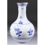An English Blue and White Delft Bottle, Mid 18th Century, painted with loose flowering sprays and