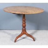 An 18th Century Burr Elm Circular Tripod Table, the burr elm veneer top on turned central column and