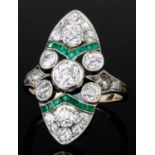 A Diamond and Emerald Ring, Early 20th Century, in gold coloured metal mount, the oval face set with