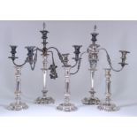A Pair of Plated Five-Light Candelabra and Three Plated Telescopic Candlesticks, the candelabra with