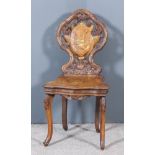 A 19th Century Swiss Musical Chair, with bold leaf, fretted and carved back of shaped outline,