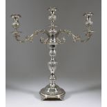 A George V Silver Three Light Candelabra, by Joseph Sweig, London 1920, the whole embossed with leaf
