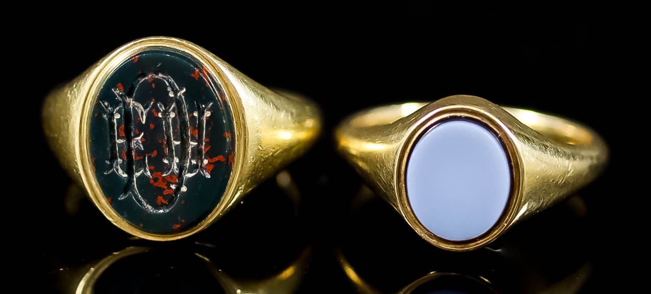 Two Signet Rings, one in 18ct gold mount, set with oval bloodstone cut with initials, size J 1/2,