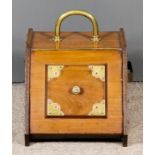 A Late Victorian Walnut and Brass Mounted Coal Scuttle, with raised panel to front and back, on
