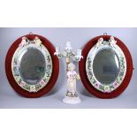 A Pair of Sitzendorf Oval Flower Encrusted Mirror Frames, 19th Century, the tops surmounted with two