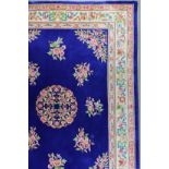A Chinese Carpet of Aubusson Design woven in colours with a central circular medallion and