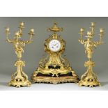 A 19th Century French Gilt Brass Three-Piece Clock Garniture of "Louis XV" Design, the clock by