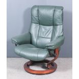 A Modern Stressless Reclining and Swivel Easy Chair, upholstered in green leather, on stained wood