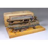 A Late 19th Century American Merritt "Linear Index Lined" Typewriter, No. 1234 7151, contained in