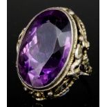 An Amethyst Dress Ring, in silvery metal mount, set with a faceted oval amethyst, 18mm x 28mm, the