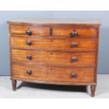 A Late George III Mahogany Bow Front Chest, with triple reeded edges to top, fitted two short and