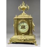 A Late 19th Century French Brass Cased Mantel Clock, the 3.75ins diameter cream enamel chapter