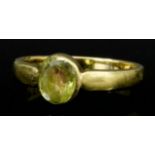 A Yellow Sapphire Ring, in 18ct gold mount, set with central faceted stone, approximate weight .