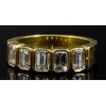 A Five Stone Diamond Ring, Modern, in gold coloured metal mount, set with five baguette cut