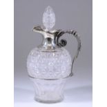 An Edward VII Silver Mounted and Cut Glass Claret Jug, by Walker & Hall, Sheffield 1904, the